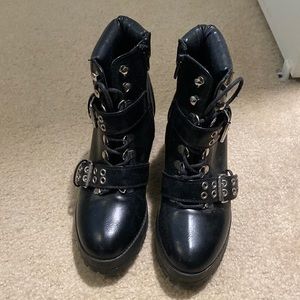 Black booties with silver buckles